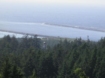 In the foreground the top of Umpqua Lightouse. In the background Umpqua River drains into the Pacific.