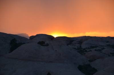 Sun sets behind the slickrocks