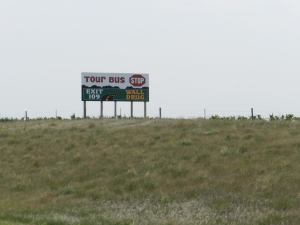 One of many signs along I-90 advertising Wall Drug.